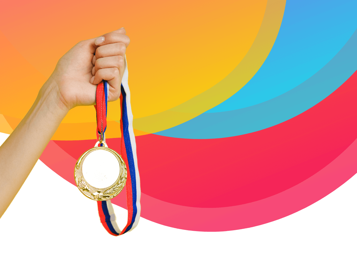 A hand holding a gold medal on a background with the Bee Digital Marketing colours