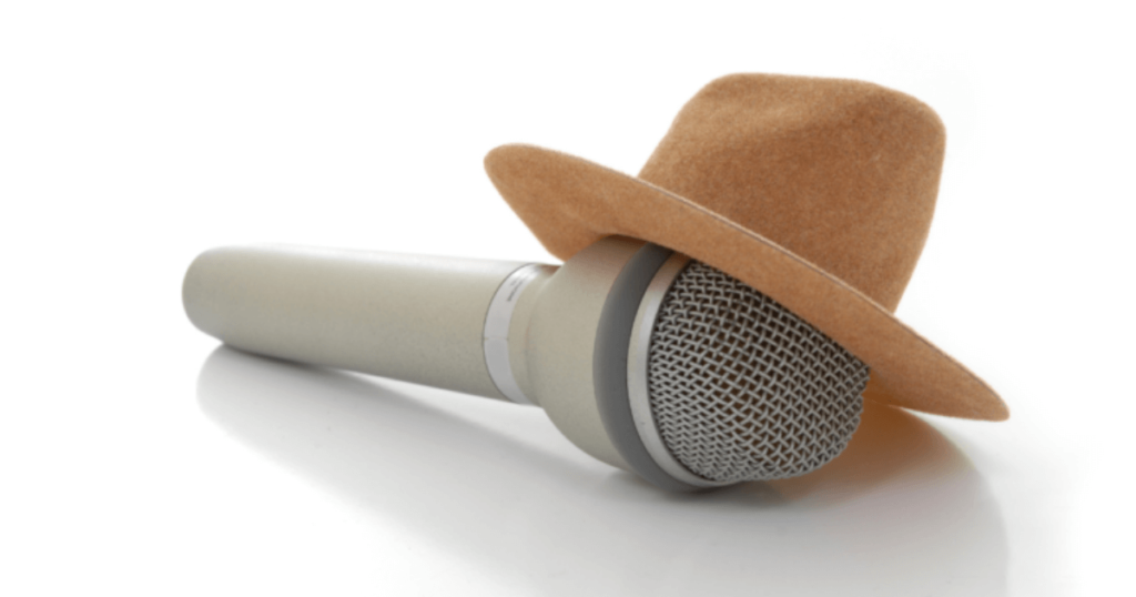 A microphone lying flat wearing a small cowboy hat
