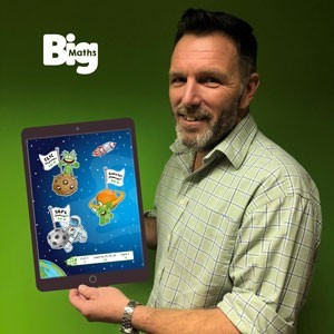 Curtis Wilson of Andrell Education holding a tablet displaying the Big Maths product
