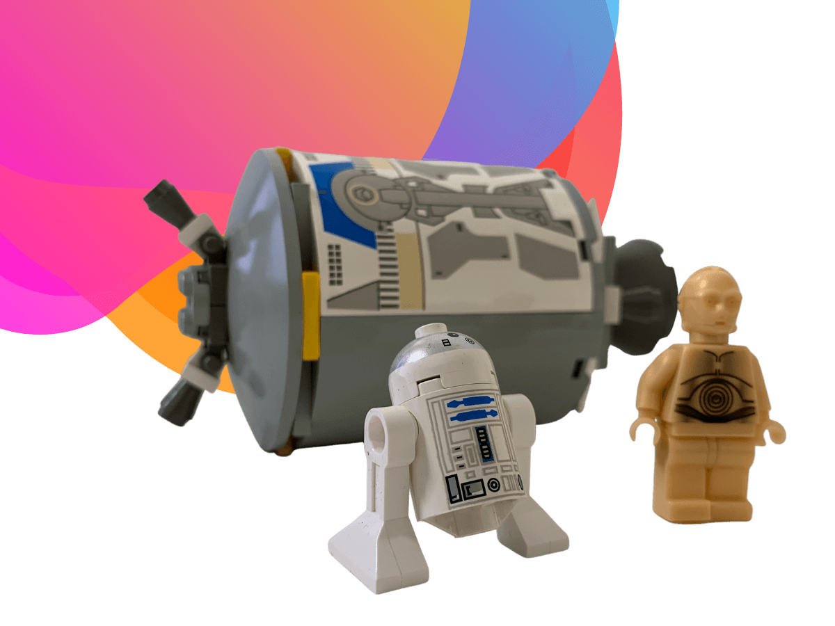 Lego figurines of R2D2 & C3P0 before an escape pod which they have just exited. Background: the Bee Digital marketing colours