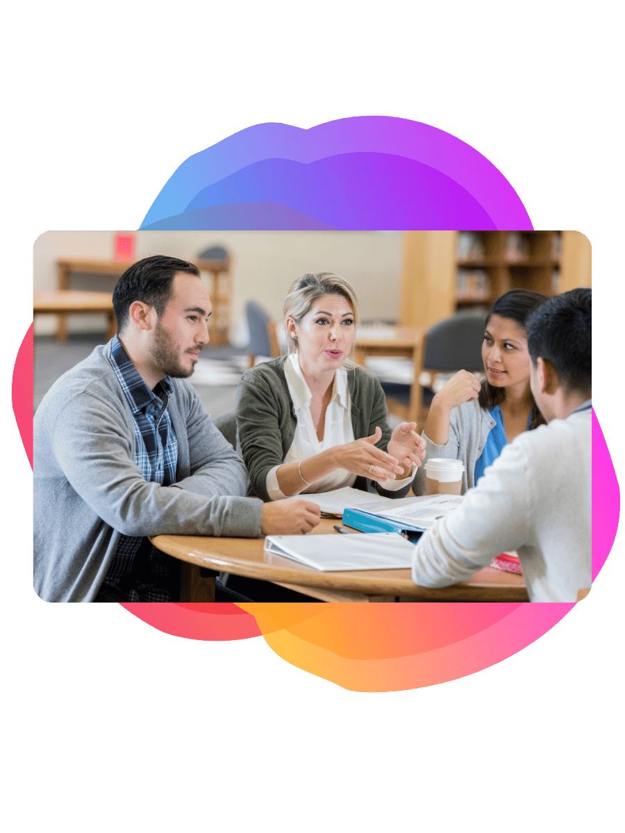 A group of teachers talking about school management systems